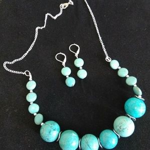 Turquoise and silver necklace and earring set.